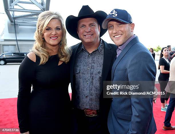 Recording artists Trisha Yearwood, Garth Brooks, and Cole Swindell attend the 50th Academy of Country Music Awards at AT&T Stadium on April 19, 2015...