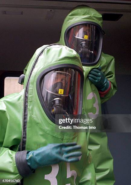 Firemen of the Berlin fire brigade wearing chemical protection suits on October 18, 2001 in Berlin, Germany.