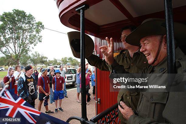 Chris Withoos and Glen Russell of the '1st Light Horse Regiment' wave goodbye to Winton residnets from aboard the ANZAC Troop Train on April 20, 2015...