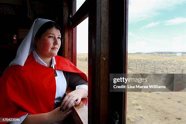 Lily Adey looks out at the view from aboard the ANZAC Troop Train on April 20, 2015 in Winton, Australia. The 2015 ANZAC Troop Train Re-Enactment...