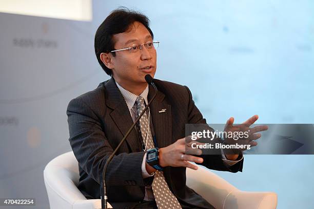 Budi Gunadi Sadikin, president director of PT Bank Mandiri, gestures as he speaks during a news conference at the World Economic Forum on East Asia...