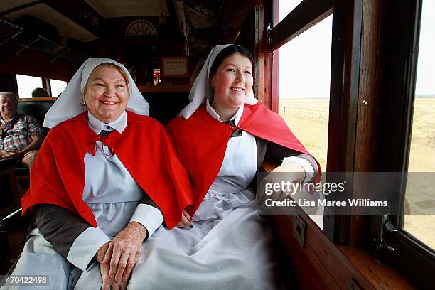 Dawn Davies and her grandaughter Lily Adey look out at the view from aboard the ANZAC Troop Train on April 20, 2015 in Winton, Australia. The 2015...