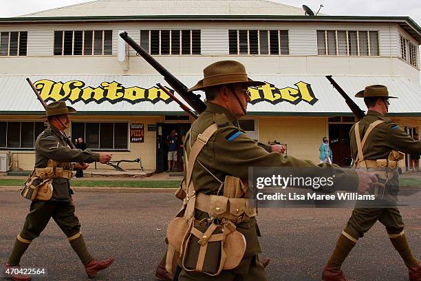 Members of the '9th Battalion AIF Living History Unit' march towards Winton station on April 20, 2015 in Winton, Australia. The 2015 ANZAC Troop...