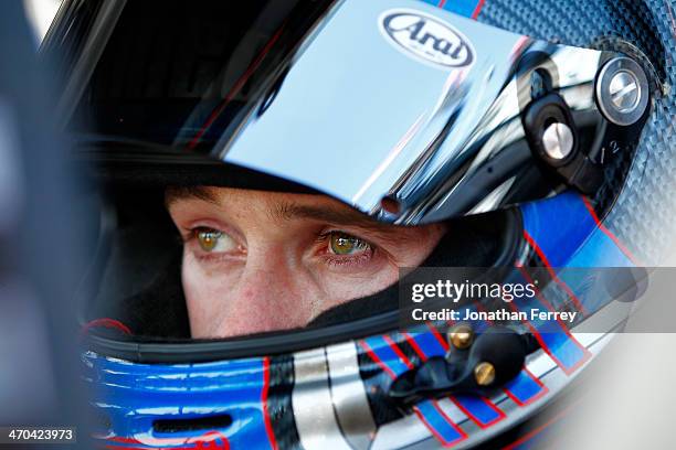 Ben Kennedy, driver of the Florida Lottery/Whelen Chevrolet, sits in his truck during practice for the NASCAR Camping World Truck Series NextEra...