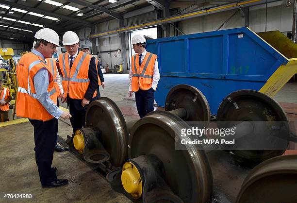 Prime Minister David Cameron and Chancellor of the Exchequer George Osborne visit a train mantenance plant in Crewe during the fourth week of their...