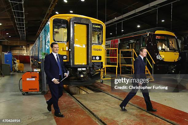 Prime Minister and leader of the Conservative Party, David Cameron and Chancellor George Osborne arrive to address guests and supporters during a...