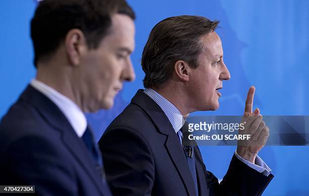 British Prime Minister and leader of the Conservative Party, David Cameron , speaks next to Conservative Chancellor of the Exchequer George Osborne...