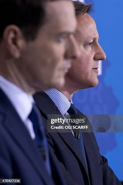British Prime Minister and leader of the Conservative Party, David Cameron , speaks next to Conservative Chancellor of the Exchequer George Osborne...