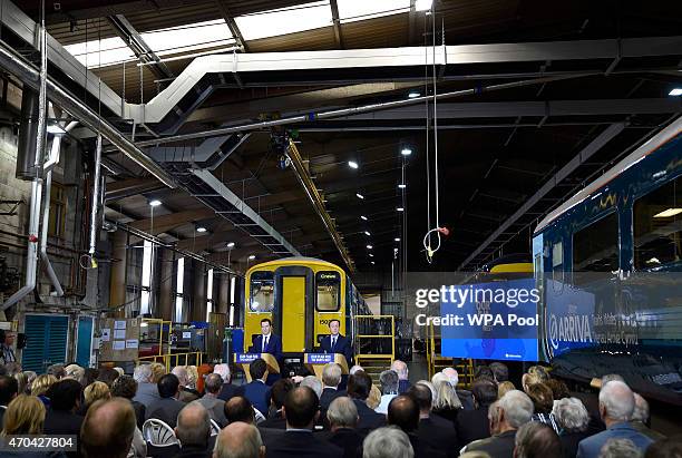 Prime Minister David Cameron and Chancellor of the Exchequer George Osborne address guests during a visit to Arriva TrainCare mantenance plant in...