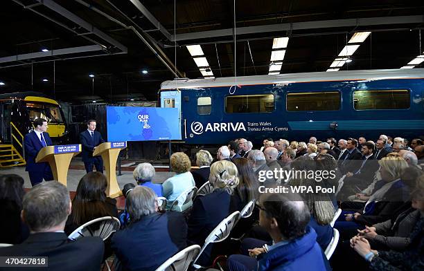 Prime Minister David Cameron and Chancellor of the Exchequer George Osborne address guests during a visit to Arriva TrainCare mantenance plant in...