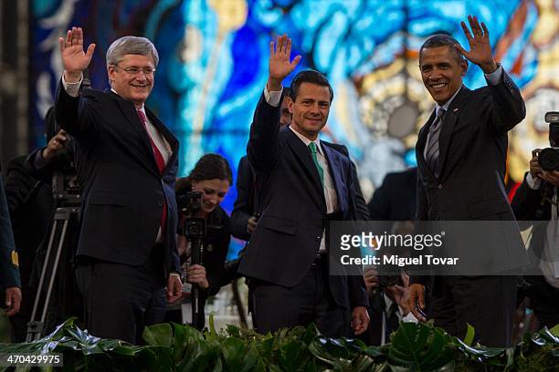 Canadian Prime Minister Stephen Harper, Mexico's President Enrique Peña Nieto and USA President Barack Obama wave during the North American Leaders...