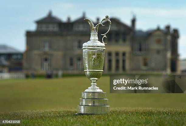 The Claret Jug sits by the Swilcan Bridge on the 18th fairway in front of the famous St Andrews club house building, during the Open Championship...