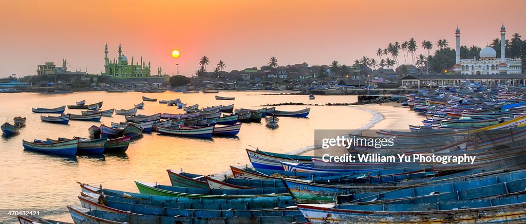 Sunset at Vizhinjam fishing harbor, India