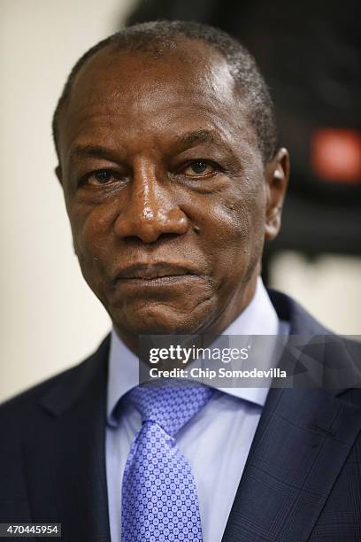 Guinea President Alpha Conde participates in a news conference about the ongoing fight against the Ebola outbreak in West Africa during the World...