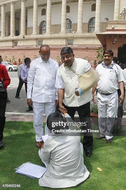 Union minister Ravi Shankar Prasad and Anant Geete with agitating Shiv Sena MP Arvind Sawant on the first day of the second part of Budget session at...