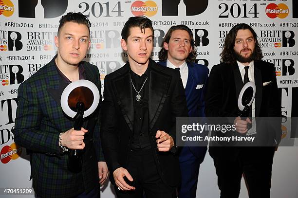 Matt Helders, Alex Turner, Jaime Cook and Nick O'Malley of Arctic Monkeys, winners of the British Group and MasterCard British Album of the Year and...