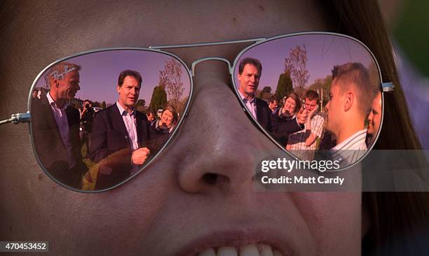 Deputy Prime Minister and Liberal Democrat party leader Nick Clegg speaks with waiting party supporters following a visit to Penrice Academy to...