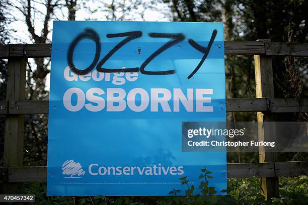 An election poster for Chancellor George Osborne is defaced in his Tatton constituency on April 20, 2015 in Knutsford, United Kingdom. Britain will...
