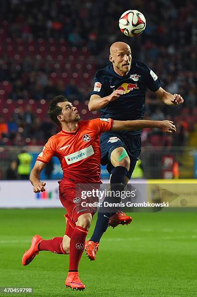 Tim Sebastian of RB Leipzig clears the ball under the pressure of Kevin Stoeger of 1. FC Kaiserslautern during the Second Bundesliga match between 1....