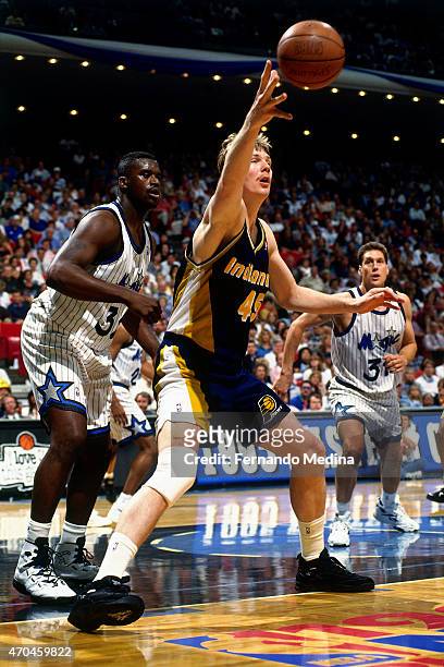 Rik Smits of the Indiana Pacers posts up against Shaquille O'Neal of the Orlando Magic during game 1 of the Eastern Conference Finals on May 23, 1995...