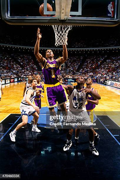 Anthony Peeler of the Los Angeles Lakers grabs a rebound against the Orlando Magic on March 8, 1995 at the Amway Arena in Orlando, Florida. NOTE TO...