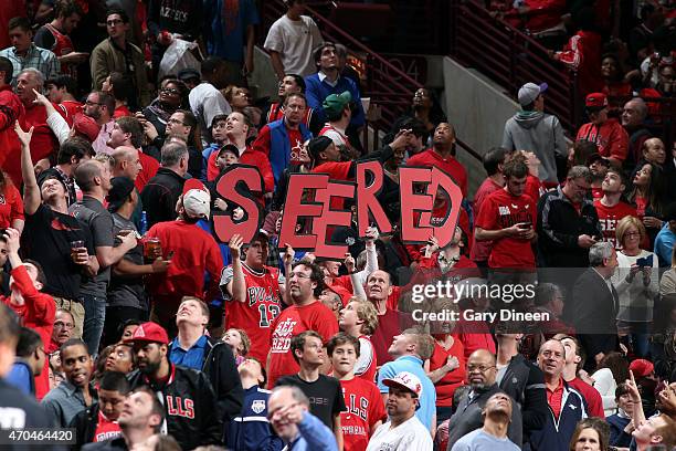 Fans of the Chicago Bulls cheer during a game against the Milwaukee Bucks in Game One of the Eastern Conference Quarterfinals during the NBA Playoffs...