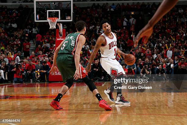Derrick Rose of the Chicago Bulls handles the ball against the Milwaukee Bucks in Game One of the Eastern Conference Quarterfinals during the NBA...