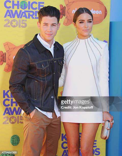 Singer Nick Jonas and Olivia Culpo arrive at Nickelodeon's 28th Annual Kids' Choice Awards at The Forum on March 28, 2015 in Inglewood, California.