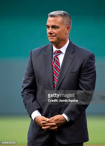 Kansas City Royals General Manager Dayton Moore watches pregame activities prior to the game against the Oakland Athletics at Kauffman Stadium on...