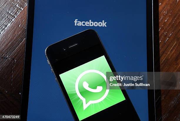 Facebook and WhatsApp logos are displayed on portable electronic devices on February 19, 2014 in San Francisco City. Facebook Inc. Announced that it...