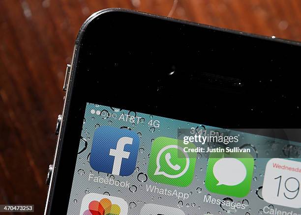 The Facebook and WhatsApp app icons are displayed on an iPhone on February 19, 2014 in San Francisco City. Facebook Inc. Announced that it will...