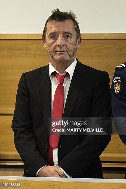 Former AC/DC drummer Phil Rudd stands in the dock facing charges at the District Court in Tauranga, New Zealand on April 21, 2015. The veteran rocker...