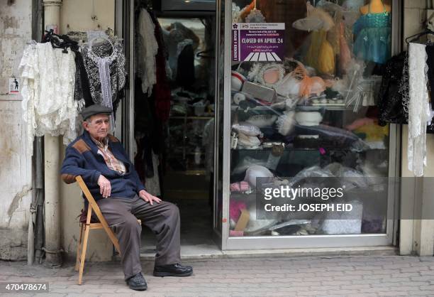 Lebanese Armenian man sits next to his shop in the Armenian dominant Burj Hammoud's area on the northern outskirts of Beirut on April 16, 2015. For...