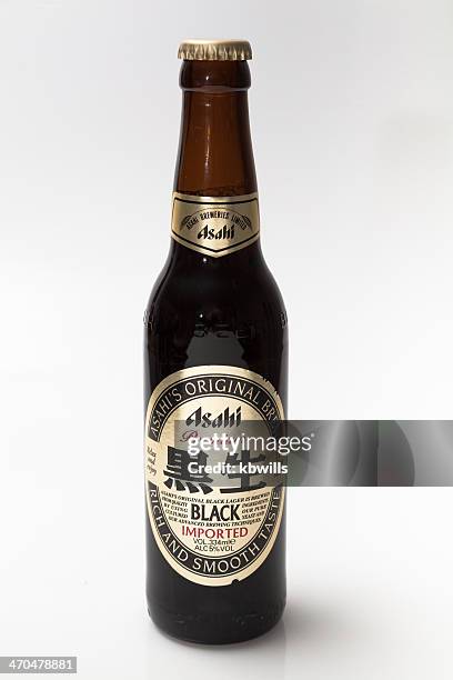 bottle of japanese imported black beer - asahi stock pictures, royalty-free photos & images