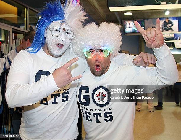 Fans pose for a photo prior to Game Three of the Western Conference Quarterfinals between the Winnipeg Jets and the Anaheim Ducks during the 2015 NHL...