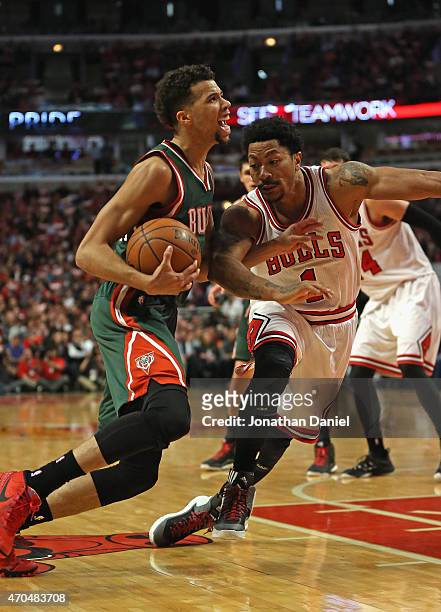 Derrick Rose of the Chicago Bulls tires to slow down Michael Carter-Williams of the Milwaukee Bucks during the first round of the 2015 NBA Playoffs...