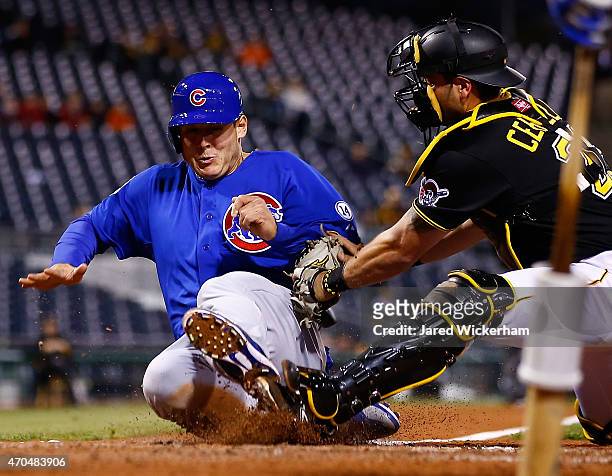Anthony Rizzo of the Chicago Cubs is tagged out at home plate by Francisco Cervelli in the fifth inning during the game at PNC Park on April 20, 2015...