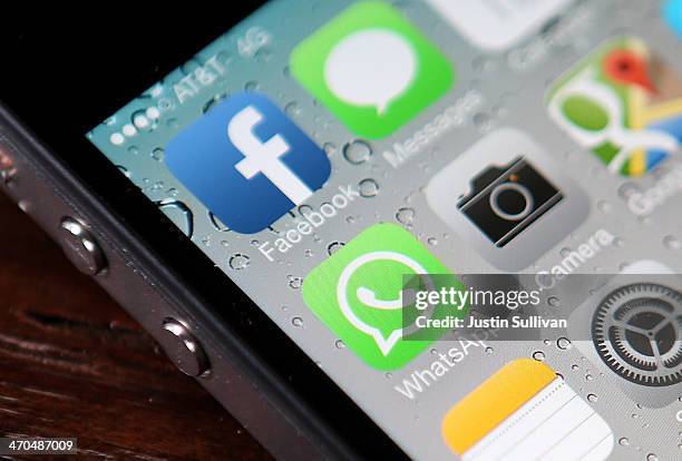 The Facebook and WhatsApp app icons are displayed on an iPhone on February 19, 2014 in San Francisco City. Facebook Inc. Announced that it will...