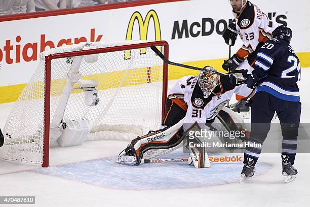 Lee Stempniak of the Winnipeg Jets scores a goal against Frederik Andersen of the Anaheim Ducks in first-period action in Game Three of the Western...