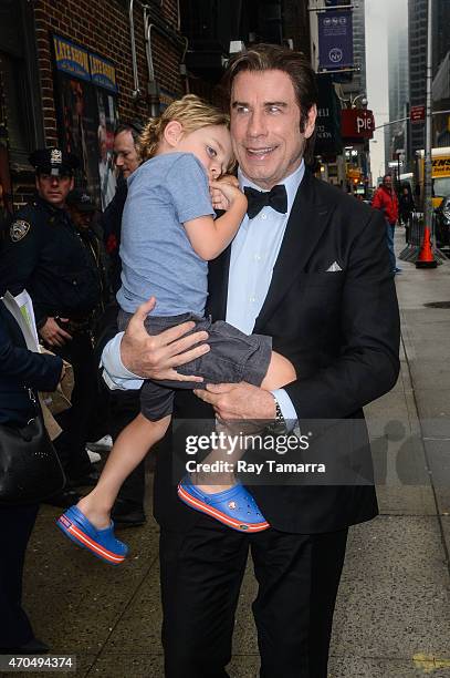 Actor John Travolta and Benjamin Travolta enter the "Late Show With David Letterman" taping at the Ed Sullivan Theater on April 20, 2015 in New York...