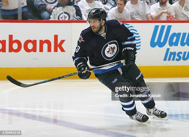 Lee Stempniak of the Winnipeg Jets follows the play down the ice during third period action against the Anaheim Ducks in Game Three of the Western...