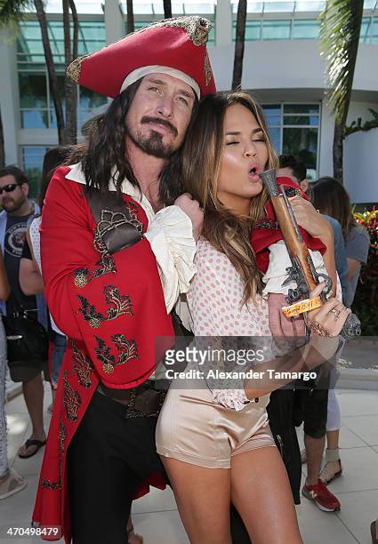 Captain Morgan and Sports Illustrated Cover Model Chrissy Teigen pose during the Captain Morgan White Rum and Sports Illustrated Swimsuit's 50th...