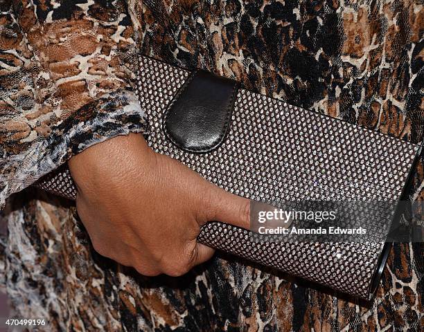 Actress Tia Carrere, clutch detail, arrives at the East West Players' Golden Anniversary Visionary Awards Dinner and Silent Auction at the Universal...