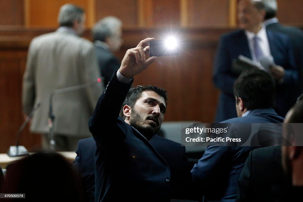 One of the accused takes a snap shot with his mobile at the...