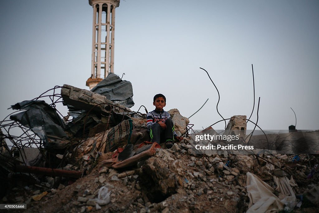 Palestinians in Shijia neighborhood, east of Gaza sitting on...