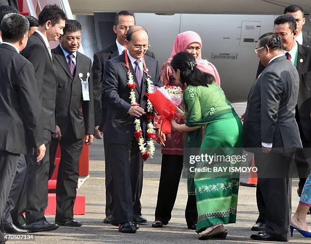 Myanmar's President Thein Sein is welcomed after arriving at Halim airport in Jakarta on April 21, 2015 ahead of the opening of the Asian-African...