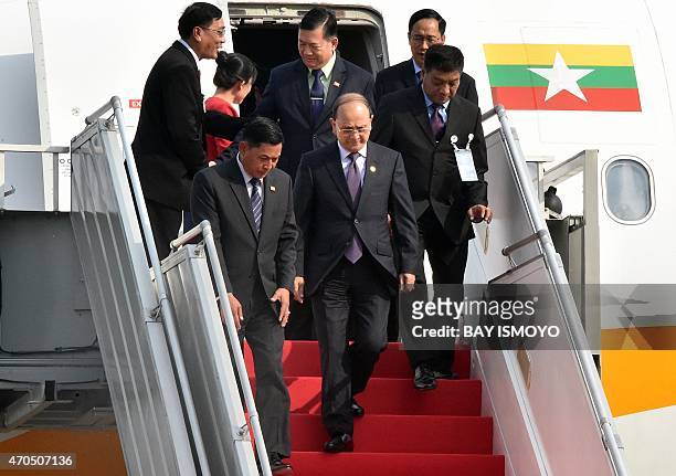 Myanmar's President Thein Sein disembarks from an aircraft after arriving at Halim airport in Jakarta on April 21, 2015 ahead of the opening of the...