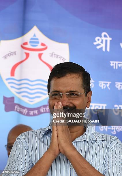Delhi chief minister, Arvind Kejriwal greets after inaugurating the Bawana water treatment plant at Bawana in northern Delhi state on April 21, 2015....
