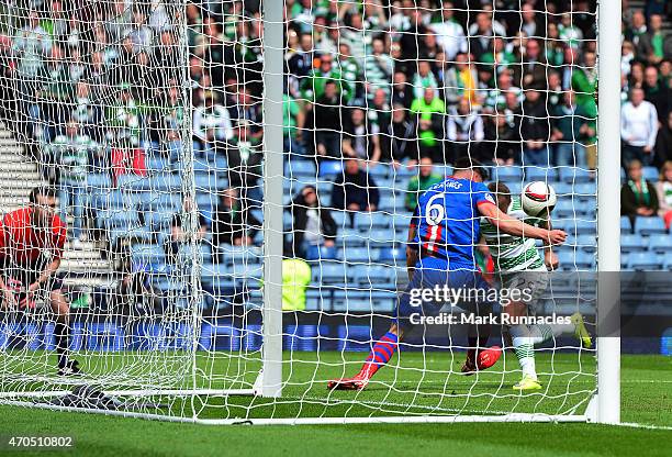 Josh Meekings of Inverness Caledonian Thistle apparently handles the ball on the goal line from Leigh Griffiths of Celtic in front of an assistant...