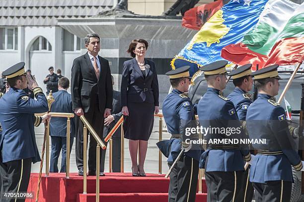 Kosovo President Atifete Jahjaga and her Bulgarian counterpart Rosen Plevneliev review the Kosovo's Security Force honor guard in Pristina on April...